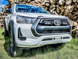 Žibintų laikiklis grotelėse Toyota Hilux 2021- 